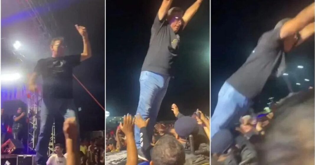 Prefeito se joga na plateia e acaba caindo no chão durante show